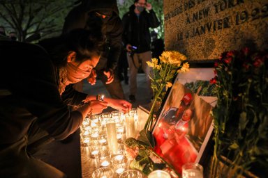 FILE PHOTO: People take part in a vigil following the fatal police shooting of 20-year-old Black man Daunte Wright in Minnesota , in Washington