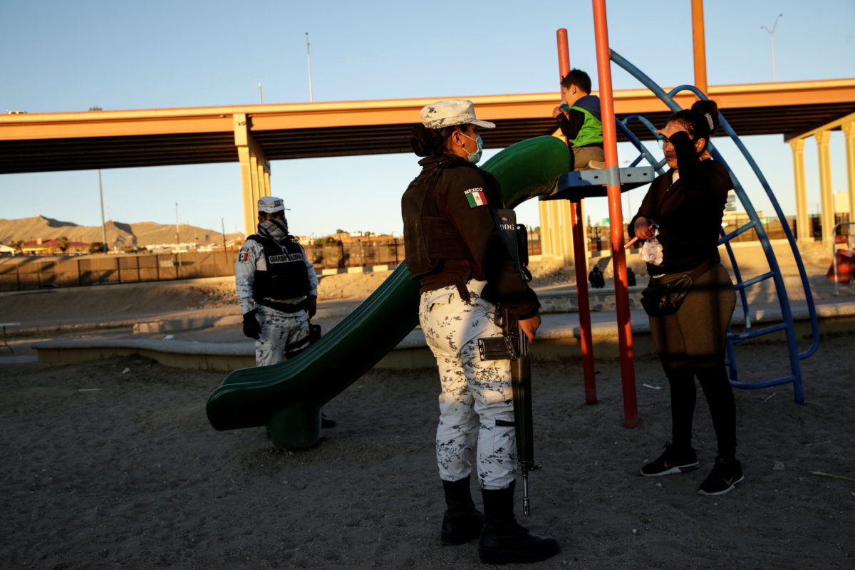 Members of the Mexican National Guard ask people to leave a park, on the side of the Rio Bravo river, as they try to control the influx of migrants crossing toward the U.S., in Ciudad Juarez