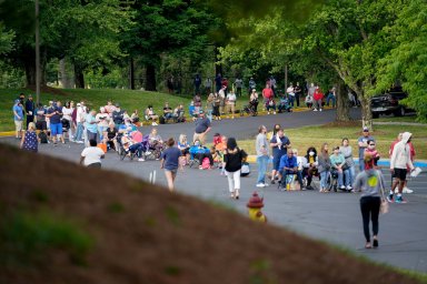 FILE PHOTO: People line up outside a Kentucky Career Center hoping to find assistance with their unemployment claim in Frankfort