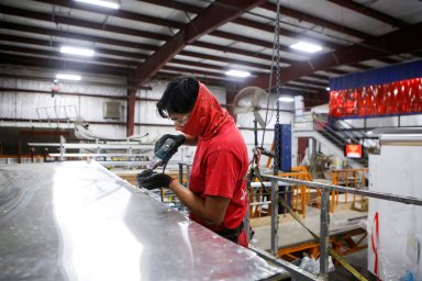 FILE PHOTO: Matt Arnold, CEO of Look Trailers, tours the company’s utility trailer manufacturing facility in Middlebury