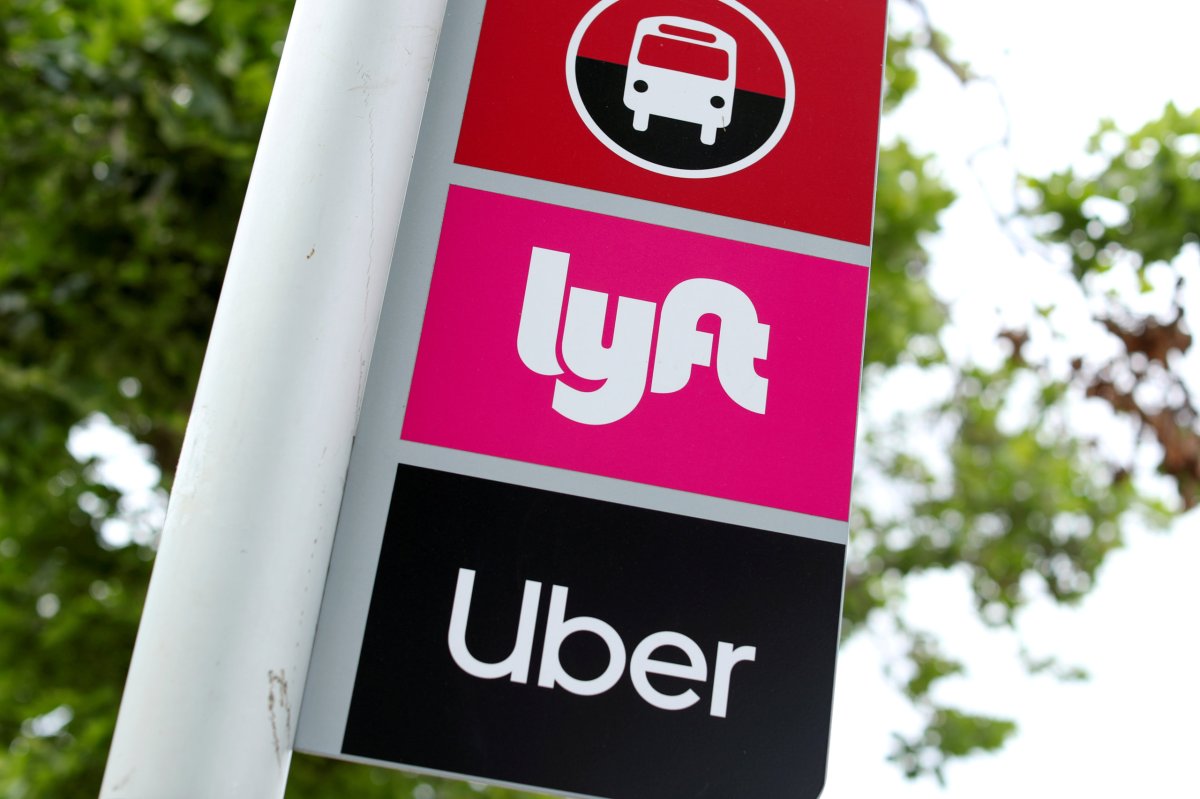 FILE PHOTO: A sign marks a rendezvous location for Lyft and Uber users at San Diego State University in San Diego