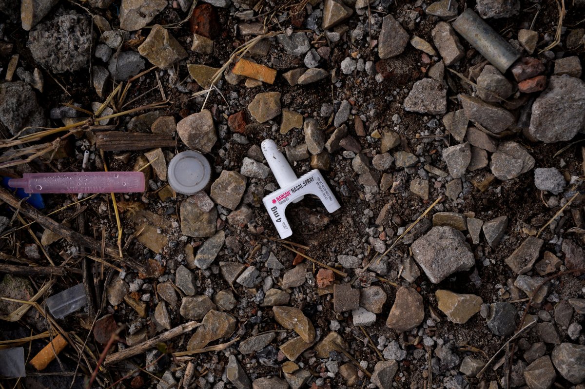 A used container of the anti-overdose drug Narcan lies on the ground in a park in the Kensington section of Philadelphia