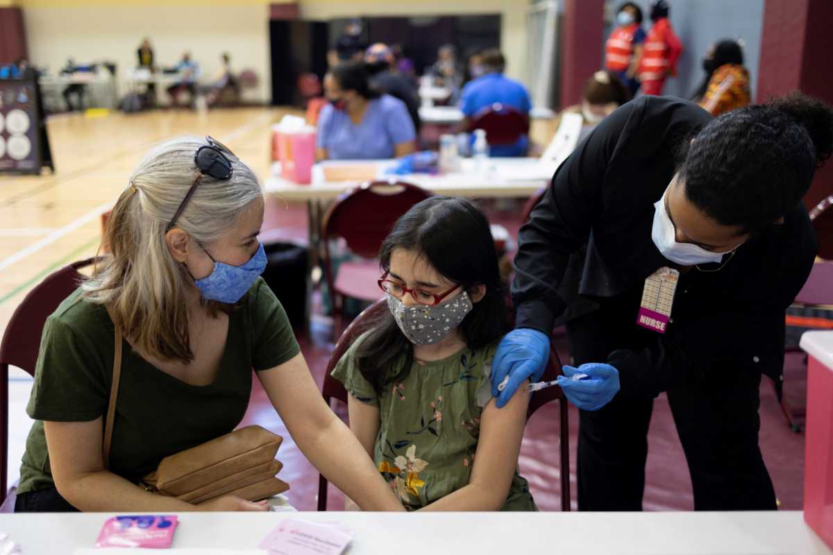 Adolescents receive COVID-19 vaccine