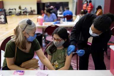 Adolescents receive COVID-19 vaccine