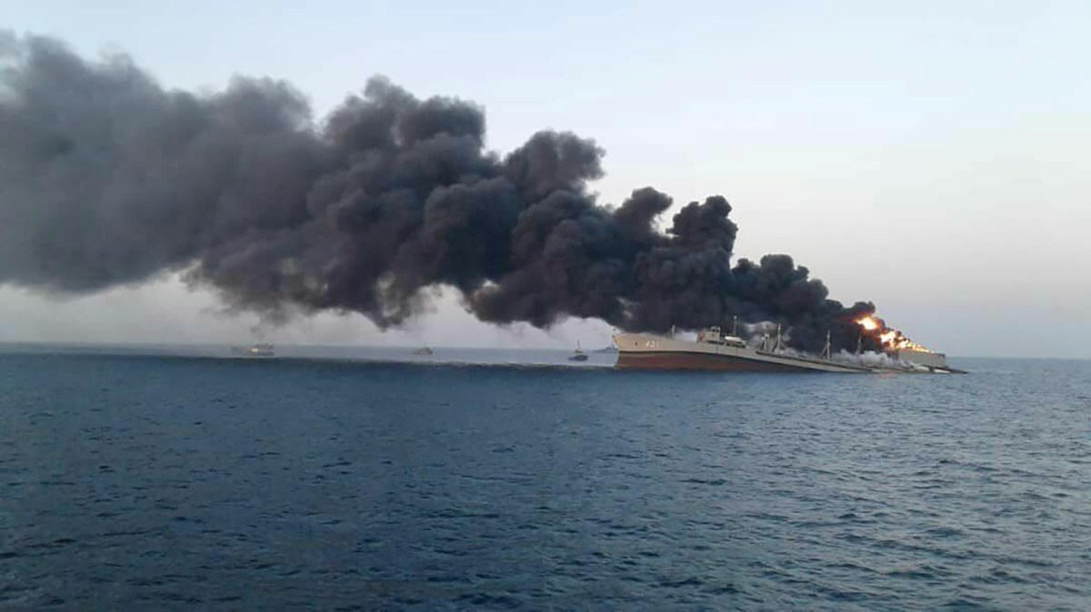 Smoke rises from Iran navy’s largest ship in Jask port in the Gulf