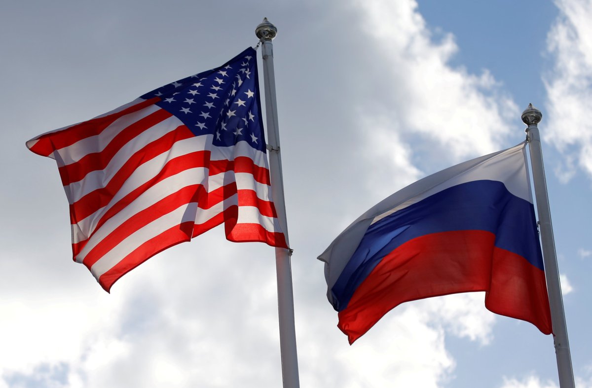 FILE PHOTO: Russian and U.S. state flags fly near a factory in Vsevolozhsk