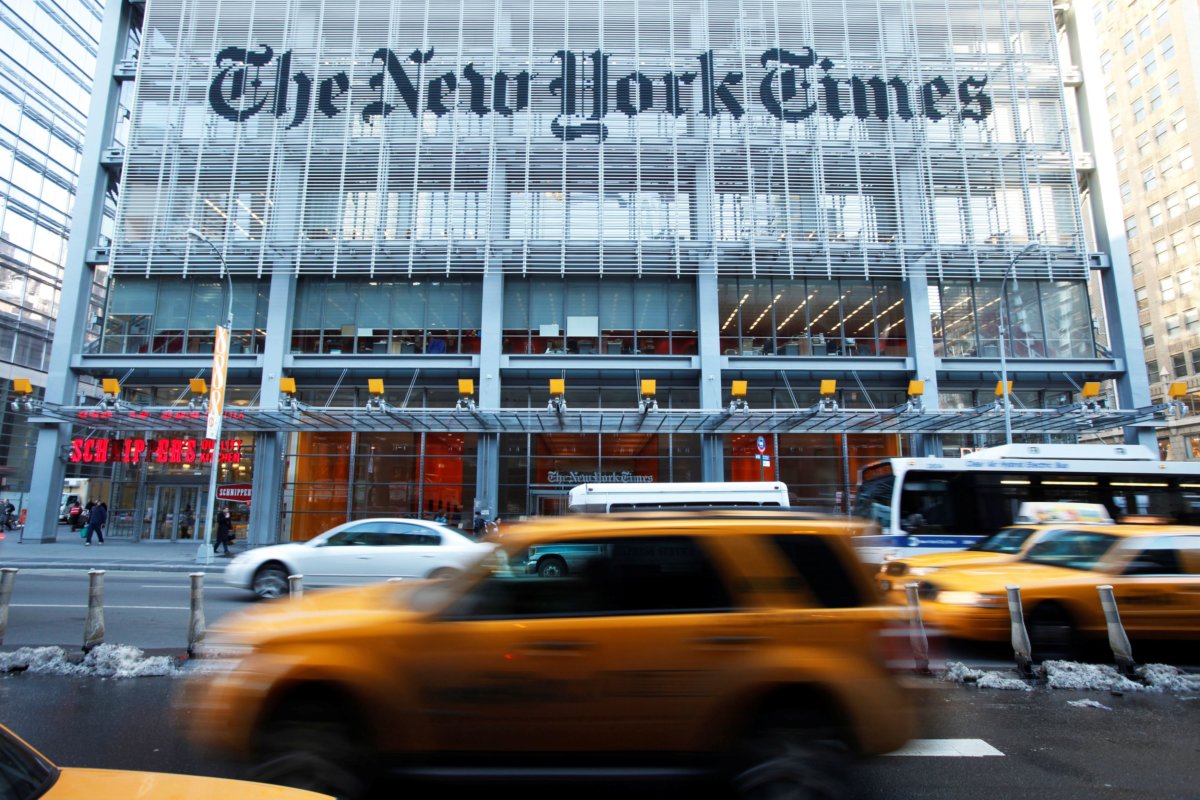 FILE PHOTO: Vehicles drive past the New York Times headquarters in New York