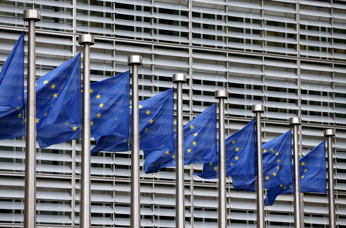 FILE PHOTO: Picture shows European Union flags fluttering outside the EU Commission headquarters in Brussels