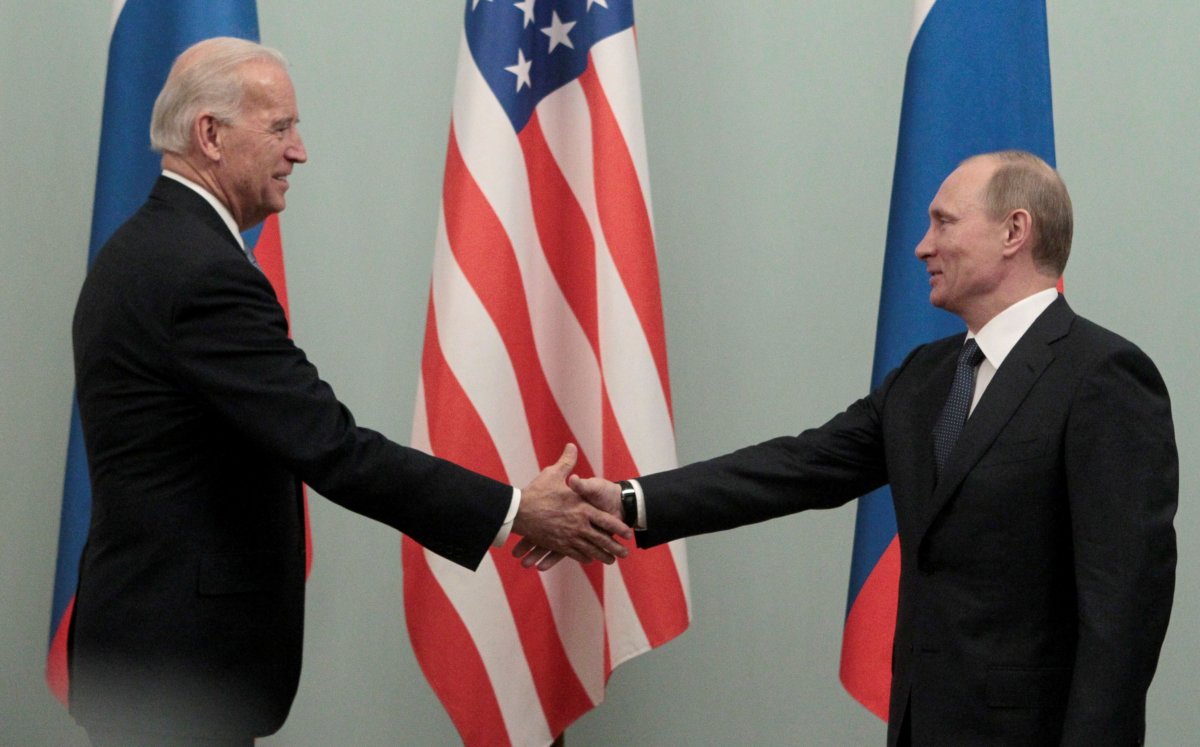 FILE PHOTO: Russian Prime minister Putin shakes hands with U.S. Vice President Biden during their meeting in Moscow