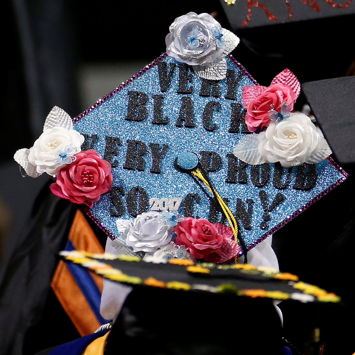 A graduate’s mortar board hat is pictured during a commencement for Medgar Evers College in the Brooklyn borough of New York City
