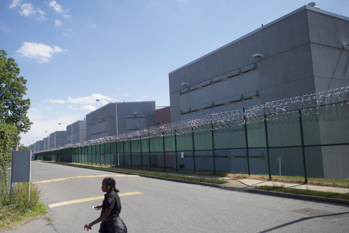 An employee exits the complex of Curran-Fromhold Correctional Facility in Philadelphia, Pennsylvania