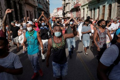 People shout slogans against the government during a protest in Havana