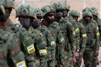 FILE PHOTO: Rwandan military troops depart for Mozambique, at the Kigali International Airport in Kigali