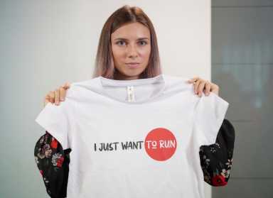 FILE PHOTO: Belarusian sprinter Krystsina Tsimanouskaya attends a news conference in Warsaw