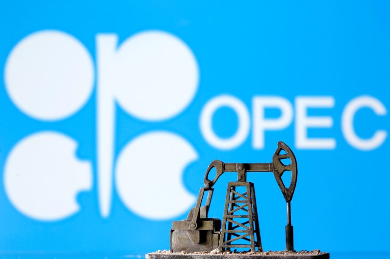 FILE PHOTO: A 3D printed oil pump jack is seen in front of displayed Opec logo in this illustration picture