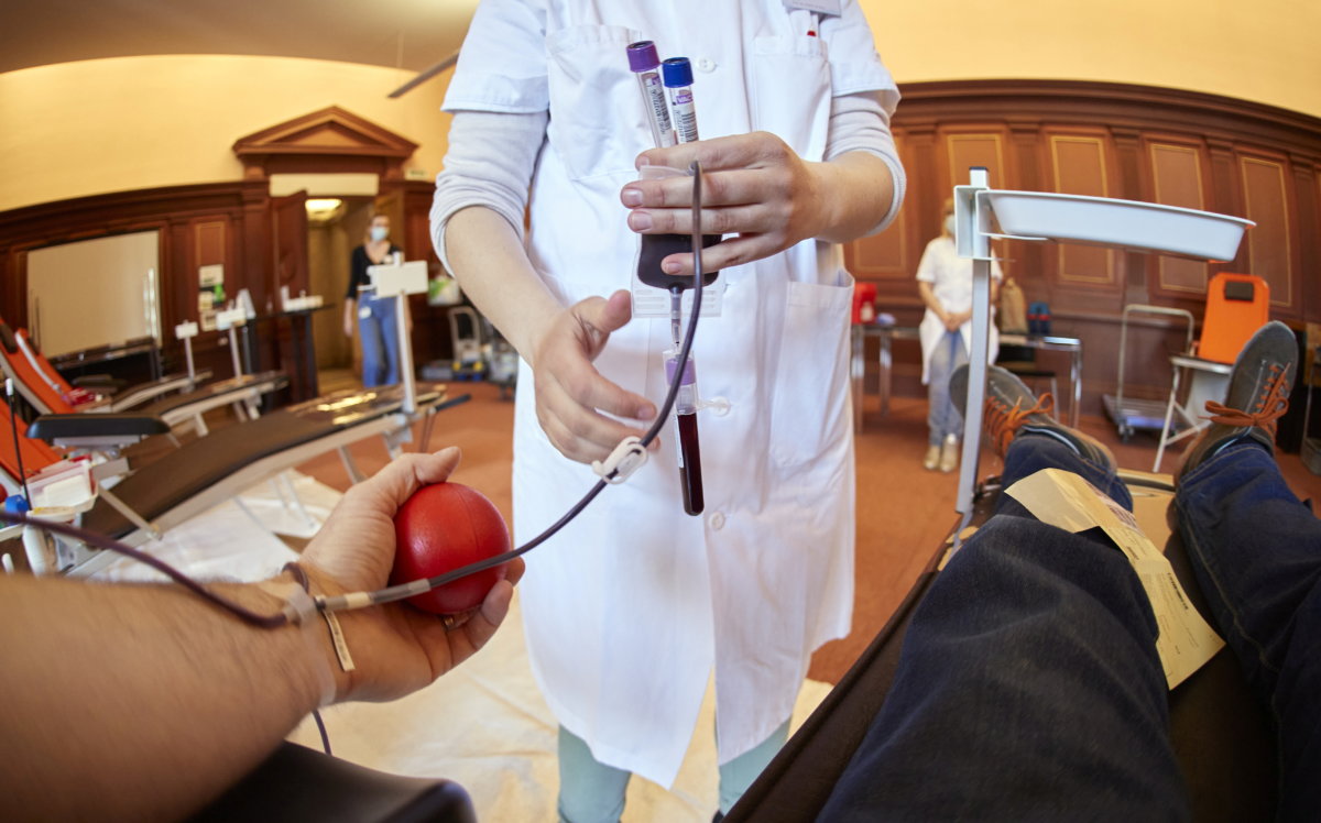 FILE PHOTO: A nurse collects samples at a blood donation centre in Lausanne