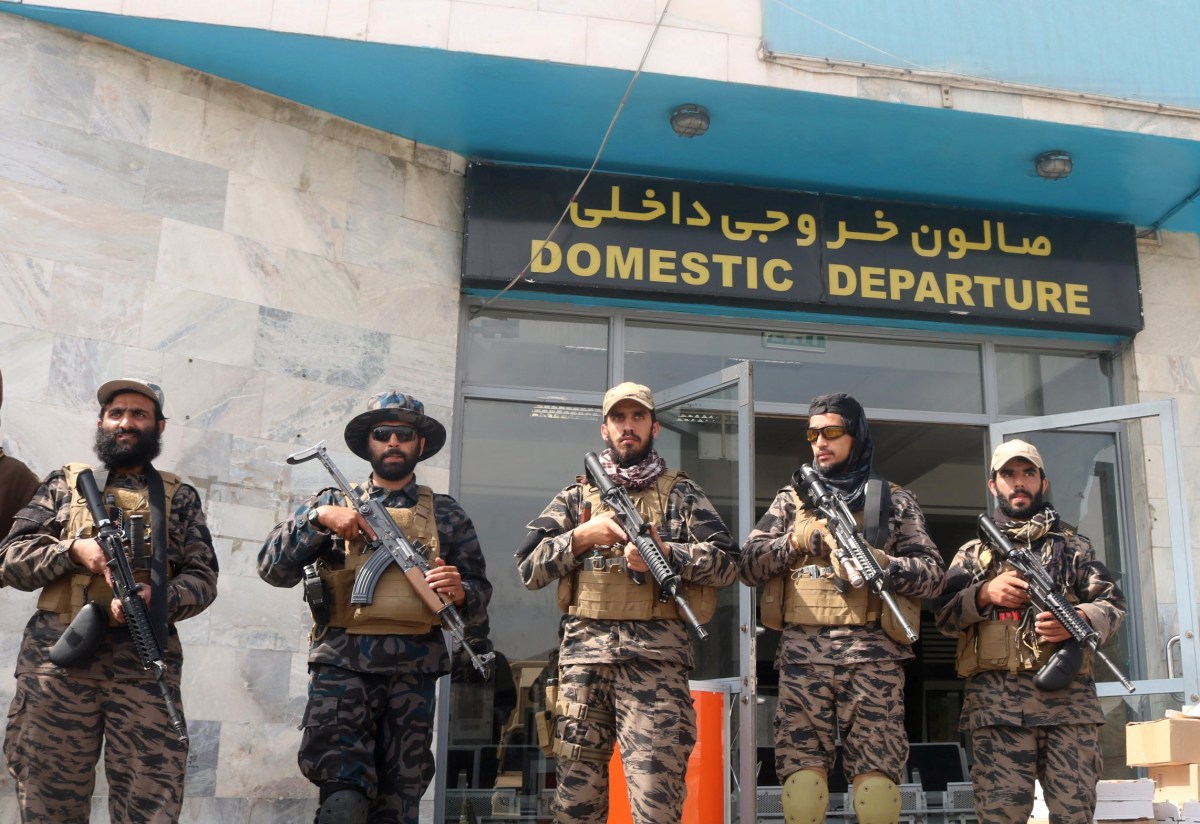 Taliban forces stand guard a day after the U.S. troops withdrawal from Hamid Karzai international airport n Kabul