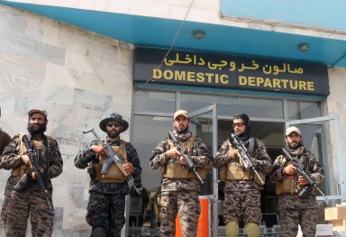 Taliban forces stand guard a day after the U.S. troops withdrawal from Hamid Karzai international airport n Kabul