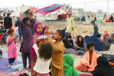 Families who arrive from Afghanistan are seen at their makeshift tents as they take refuge near a railway station in Chaman