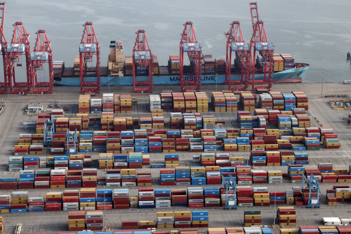 FILE PHOTO: Shipping containers are unloaded from a ship at a container terminal at the Port of Long Beach-Port of Los Angeles complex, amid the coronavirus disease (COVID-19) pandemic, in Los Angeles