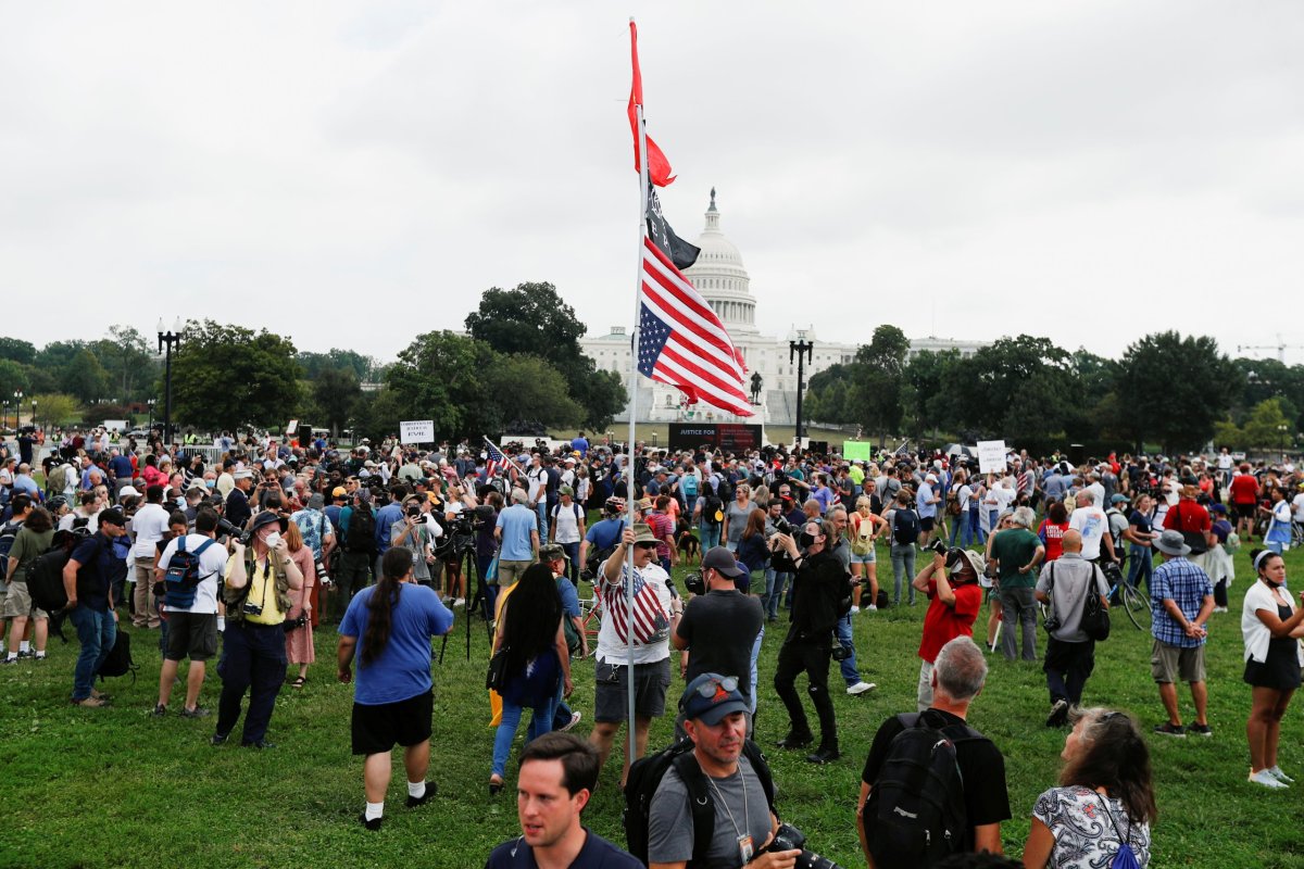 People gather in front of the U.S. Capitol during a protest in support of defendants being prosecuted in the January 6 attack on the Capitol, in Washington