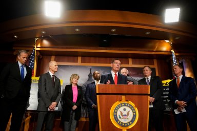 U.S. Senator John Barrasso speaks as Senators John Thune, Rick Scott, Cindy Hyde-Smith, Tim Scott, John Cornyn, Steve Daines and Pat Toomey listen during a news conference criticizing Democrats, in Washington