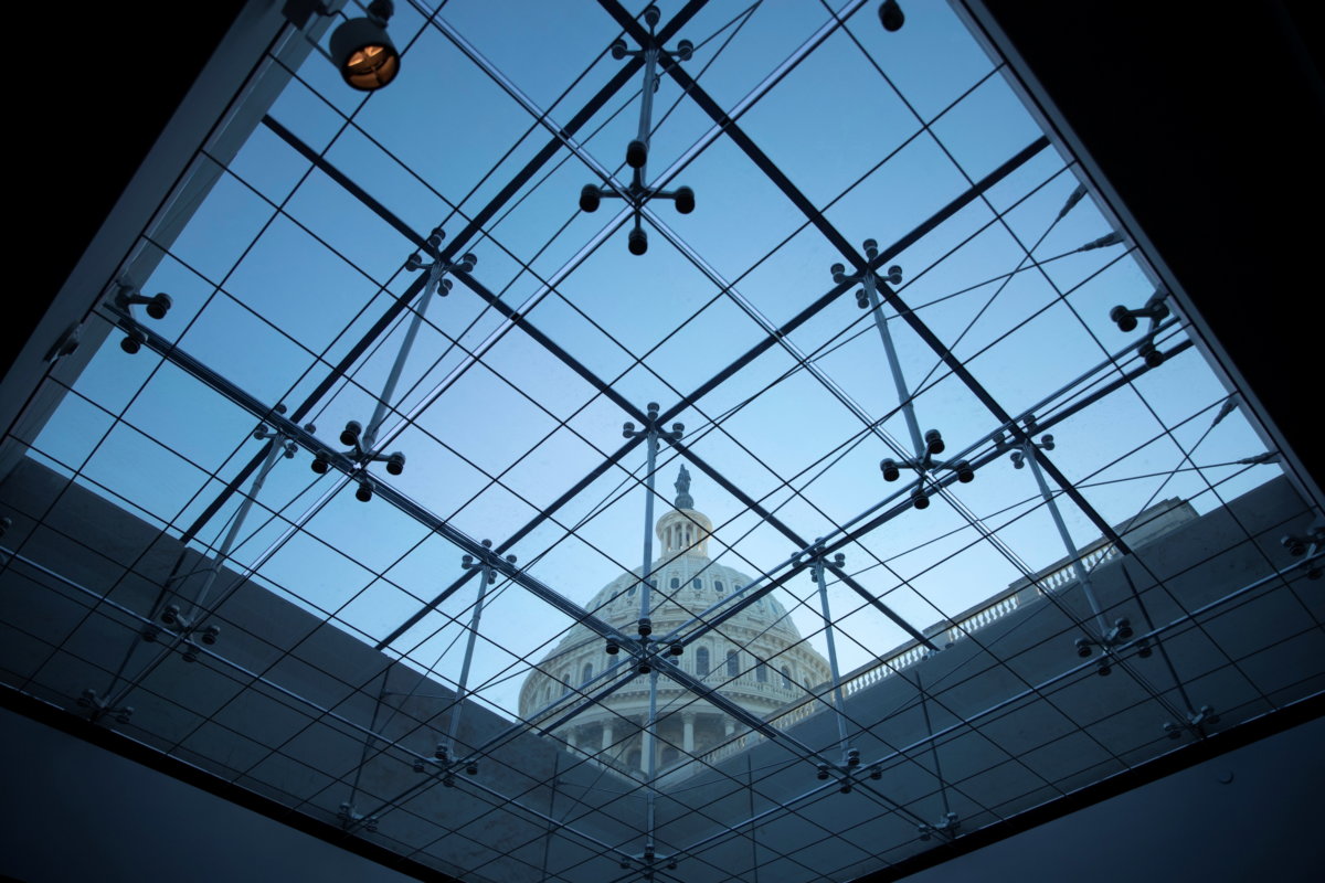 The U.S. Capitol seen through a skylight window at dusk on Capitol Hill in Washington