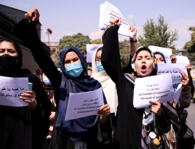 FILE PHOTO: Afghan women’s rights defenders and civil activists protest to call on the Taliban for the preservation of their achievements and education, in front of the presidential palace in Kabul