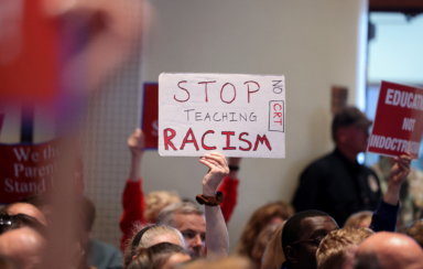 FILE PHOTO: A Virginia School board meeting reflects a battle playing out across the country over a once-obscure academic doctrine known as Critical Race Theory, in Ashburn