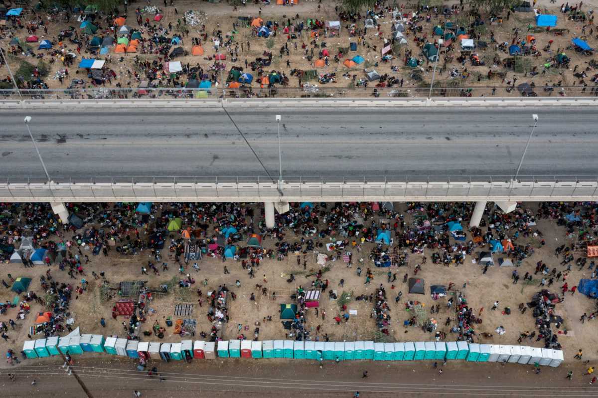 FILE PHOTO: Migrants shelter near Del Rio International Bridge in Del Rio, Texas