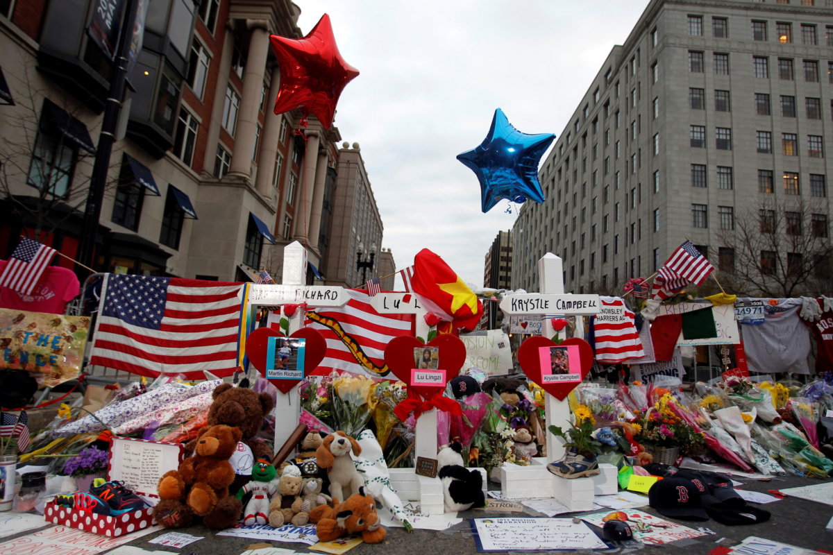 FILE PHOTO: Crosses for each of the three people killed in the Boston Marathon bombings are seen at a makeshift memorial in Boston