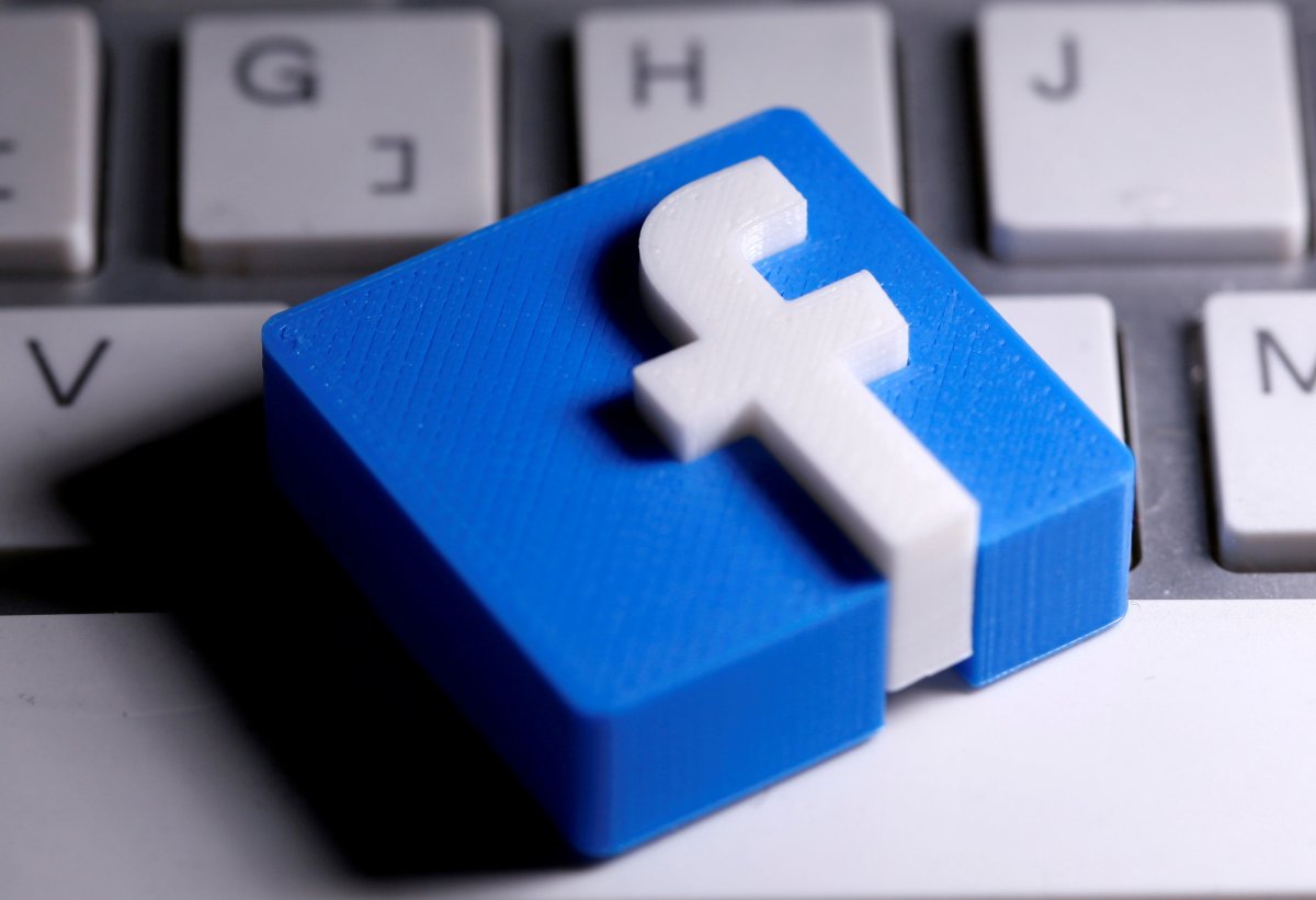 FILE PHOTO: A 3D-printed Facebook logo is seen placed on a keyboard in this illustration