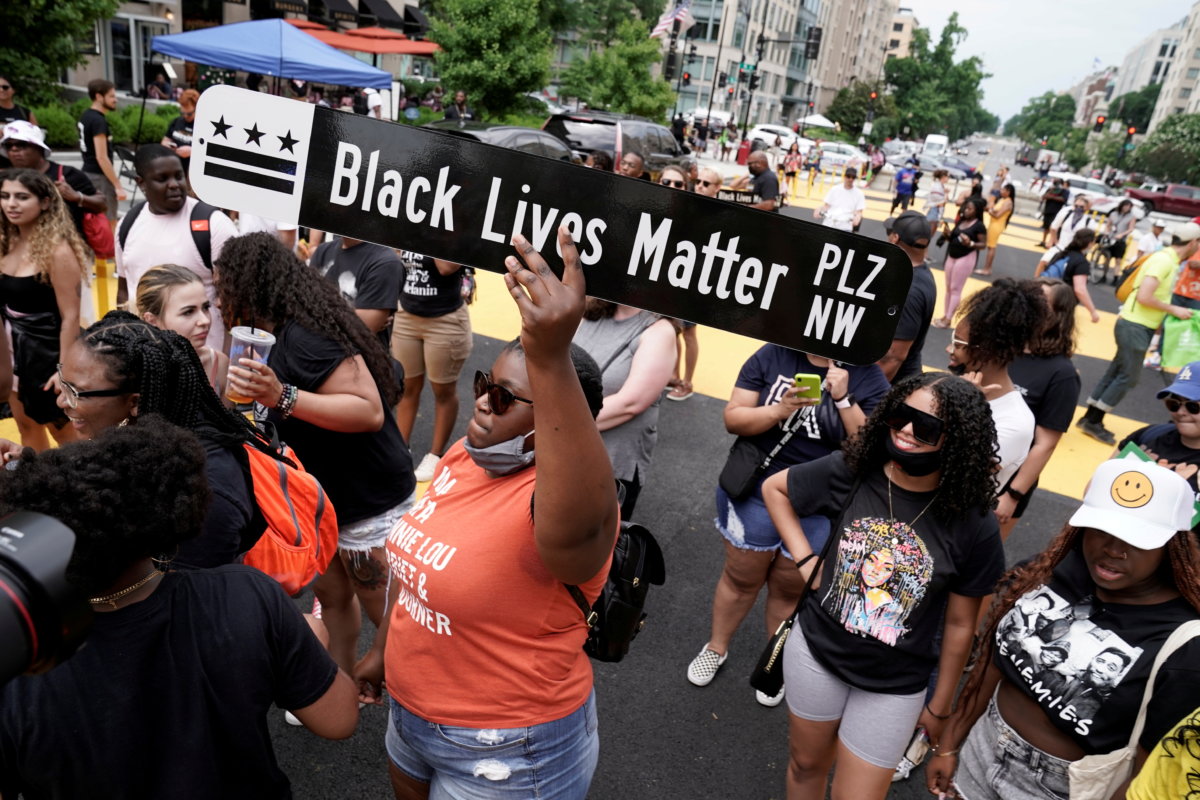 FILE PHOTO: People celebrate Juneteenth at Black Lives Matter Plaza in Washington