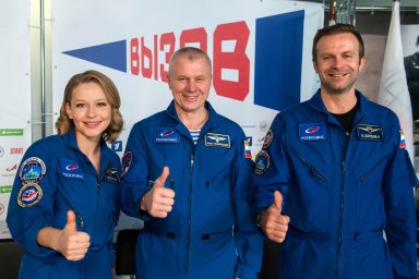 Roscosmos cosmonaut Oleg Novitskiy, actress Yulia Peresild and film director Klim Shipenko take part in a news conference in Star City