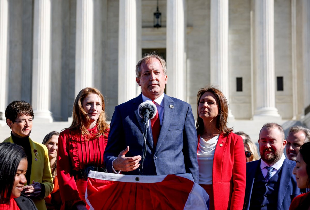 Texas Attorney General Ken Paxton speaks to anti-abortion activists outside the U.S. Supreme Court, in Washington