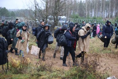 Migrants gather on the Belarusian-Polish border