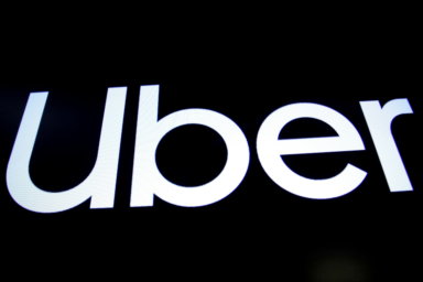 FILE PHOTO: A screen displays the company logo of Uber Technologies Inc in New York