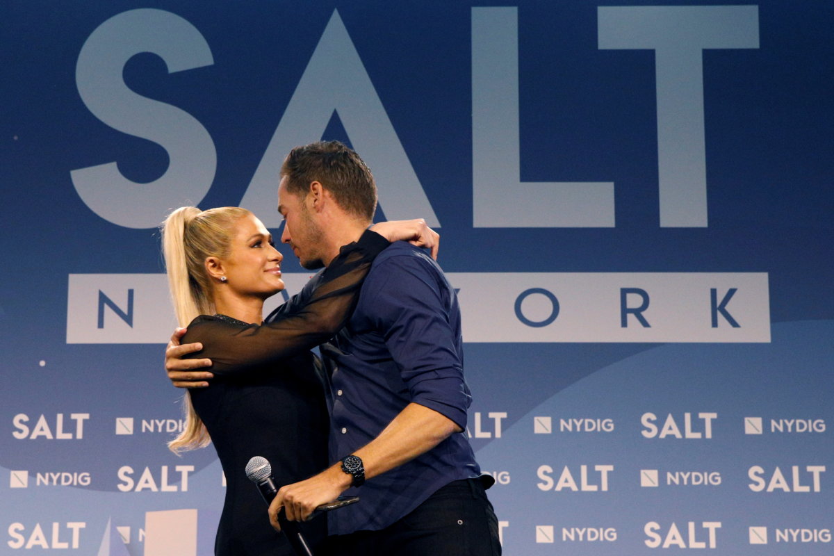 FILE PHOTO: Carter Reum embraces fiance Paris Hilton, following a keynote discussion together at the Skybridge Capital SALT New York 2021 conference in New York