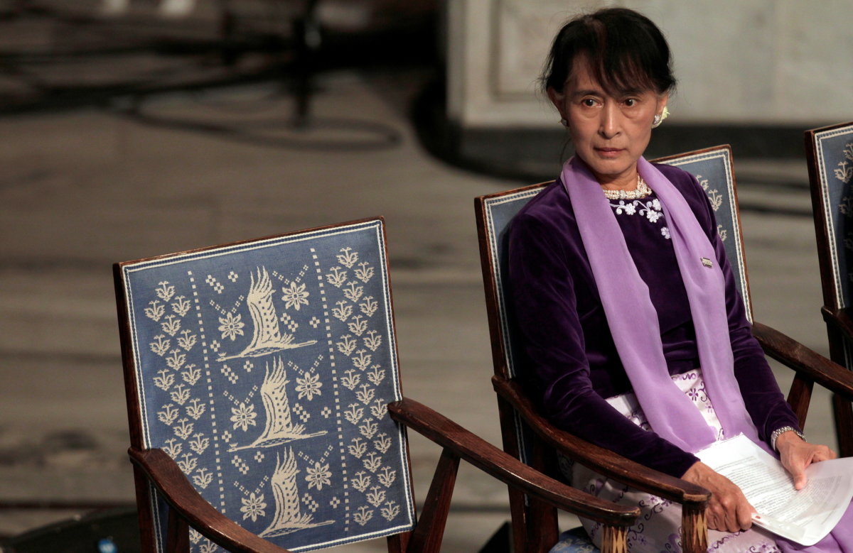 FILE PHOTO: Myanmar opposition leader Aung San Suu Kyi sits before giving her Nobel Lecture at City Hall in Oslo