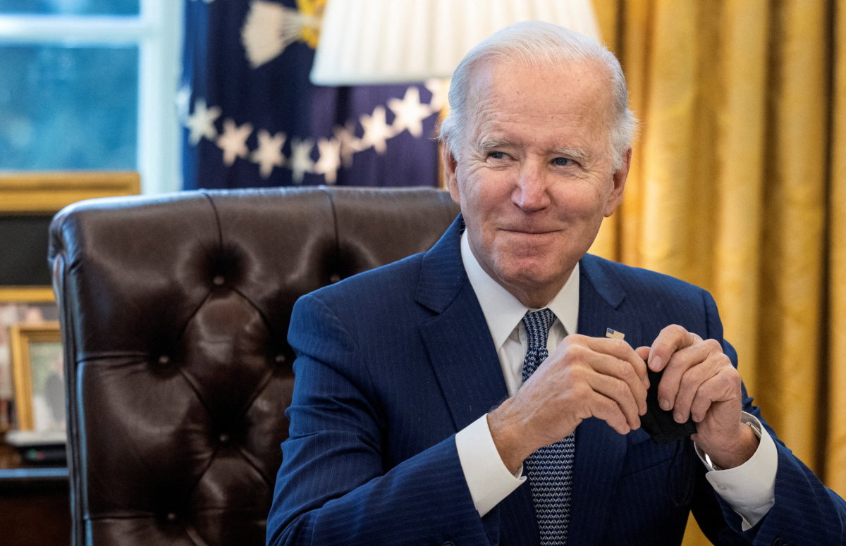 U.S. President Joe Biden signs executive order on reducing government bureaucracy at the White House in Washington
