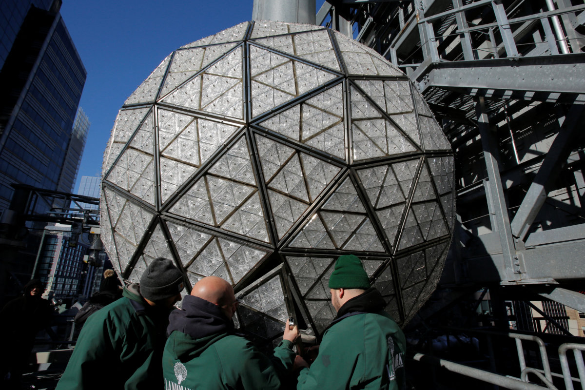 Workers install Waterford Crystal triangles on the Times Square New Year’s Eve Ball on the roof of One Times Square in Manhattan, New York