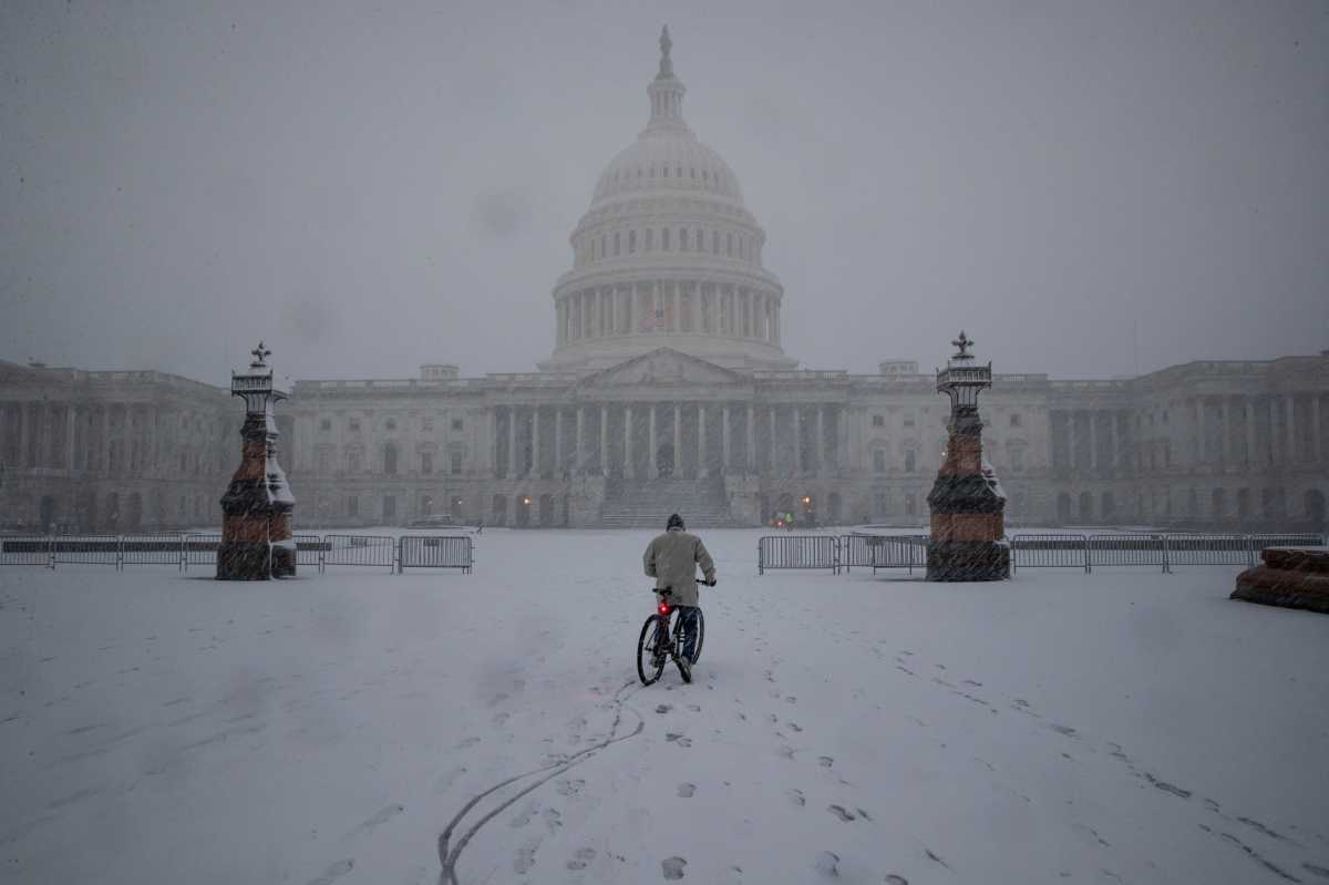 Snow falls during a winter storm on Capitol Hill, in Washington