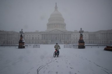 Snow falls during a winter storm on Capitol Hill, in Washington