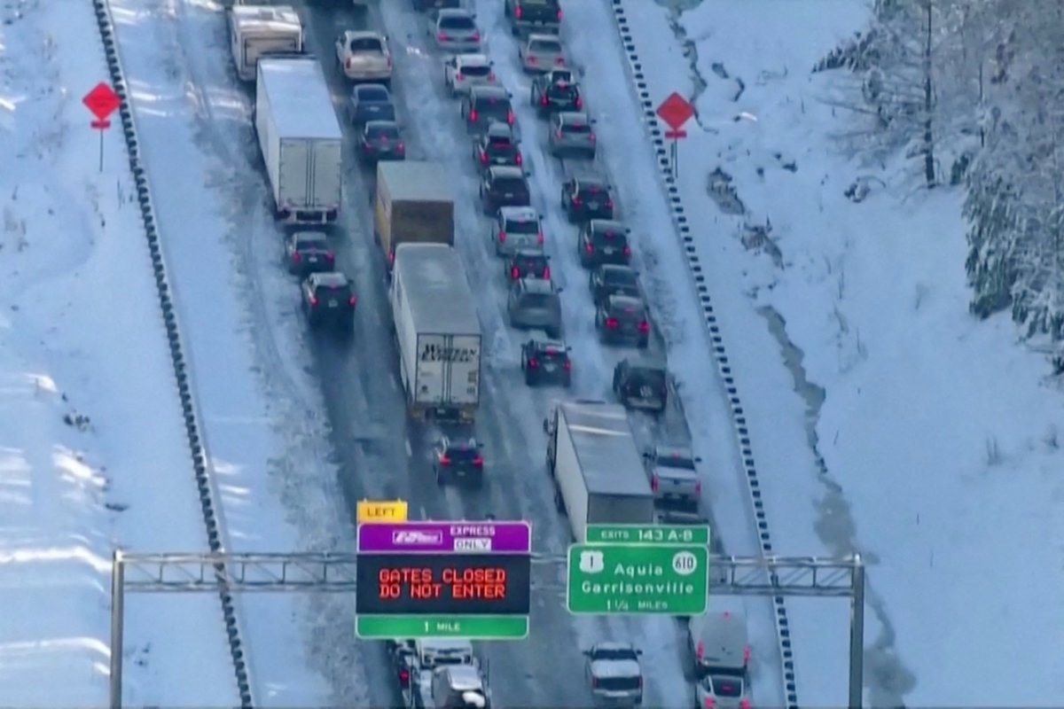 Vehicles are seen on an icy stretch of Interstate 95