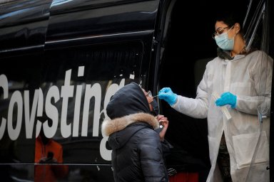 A woman takes a coronavirus disease (COVID-19) test at pop-up testing site in Brooklyn, New York