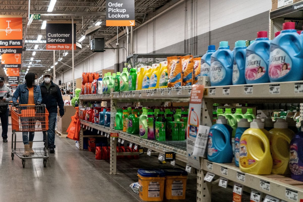 FILE PHOTO: Shoppers browse in a Home Depot building supplies store while wearing masks in St Louis