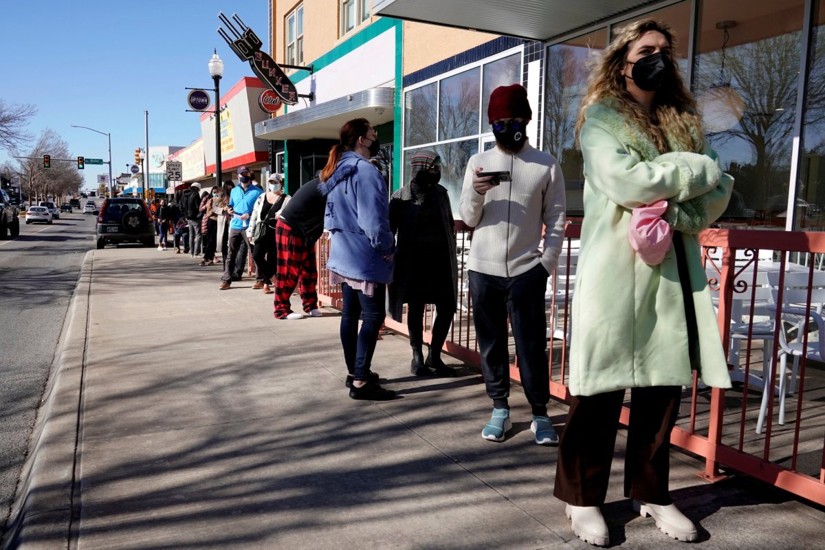 People wait in line to be tested for COVID-19 at the Tower Theatre in Oklahoma City