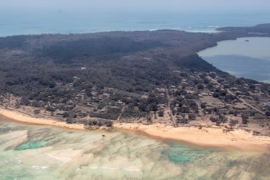 A general view from a New Zealand Defence Force P-3K2 Orion surveillance flight shows heavy ash fall over Nomuka in Tonga