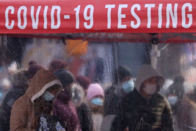 People queue to be tested for COVID-19 in Times Square in Manhattan, New York City