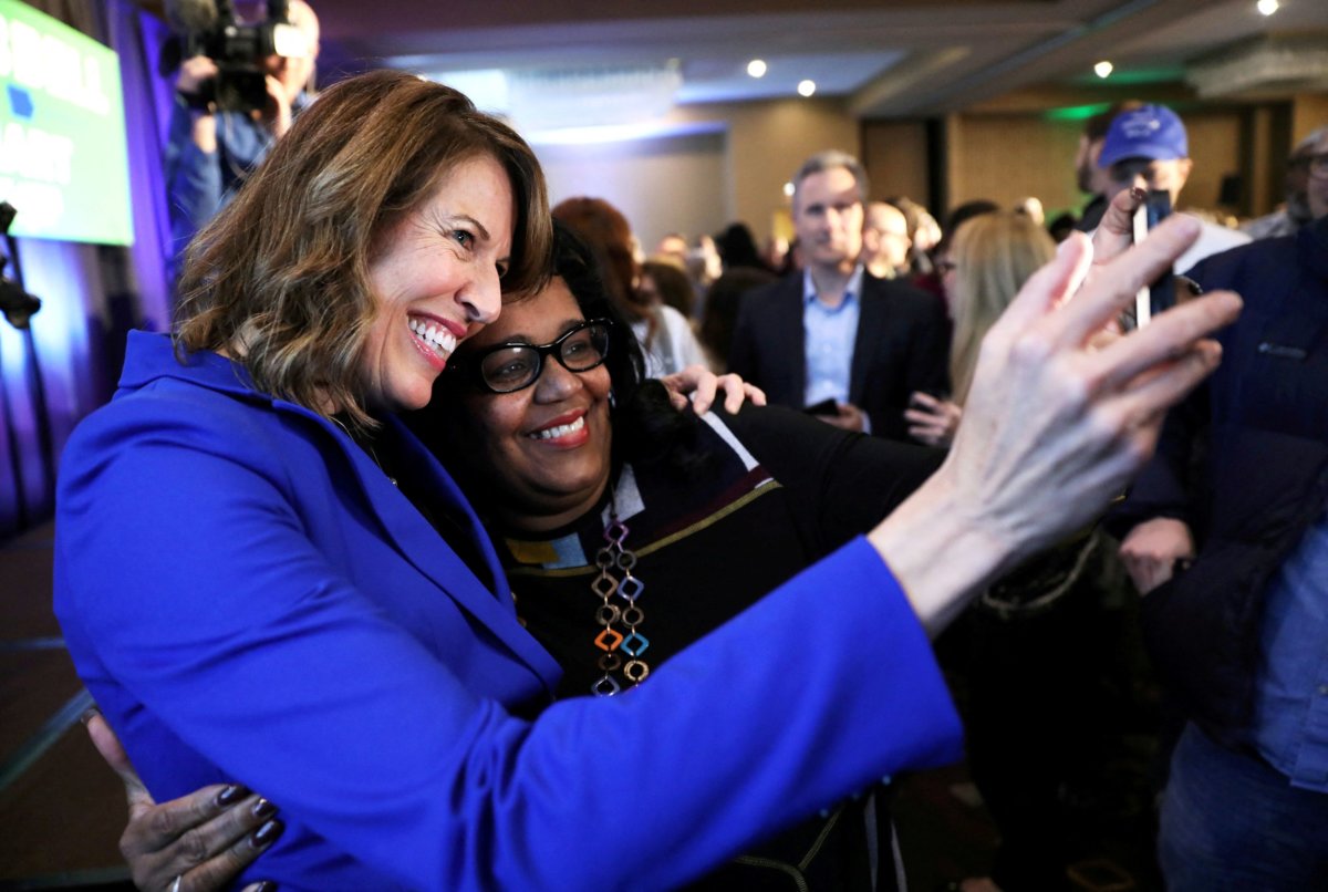 FILE PHOTO: Democratic congressional candidate Cindy Axne (left) takes a photo with West Des Moines City Councilwoman Renee Hardman while appearing at her midterm election night party in Des Moines, Iowa